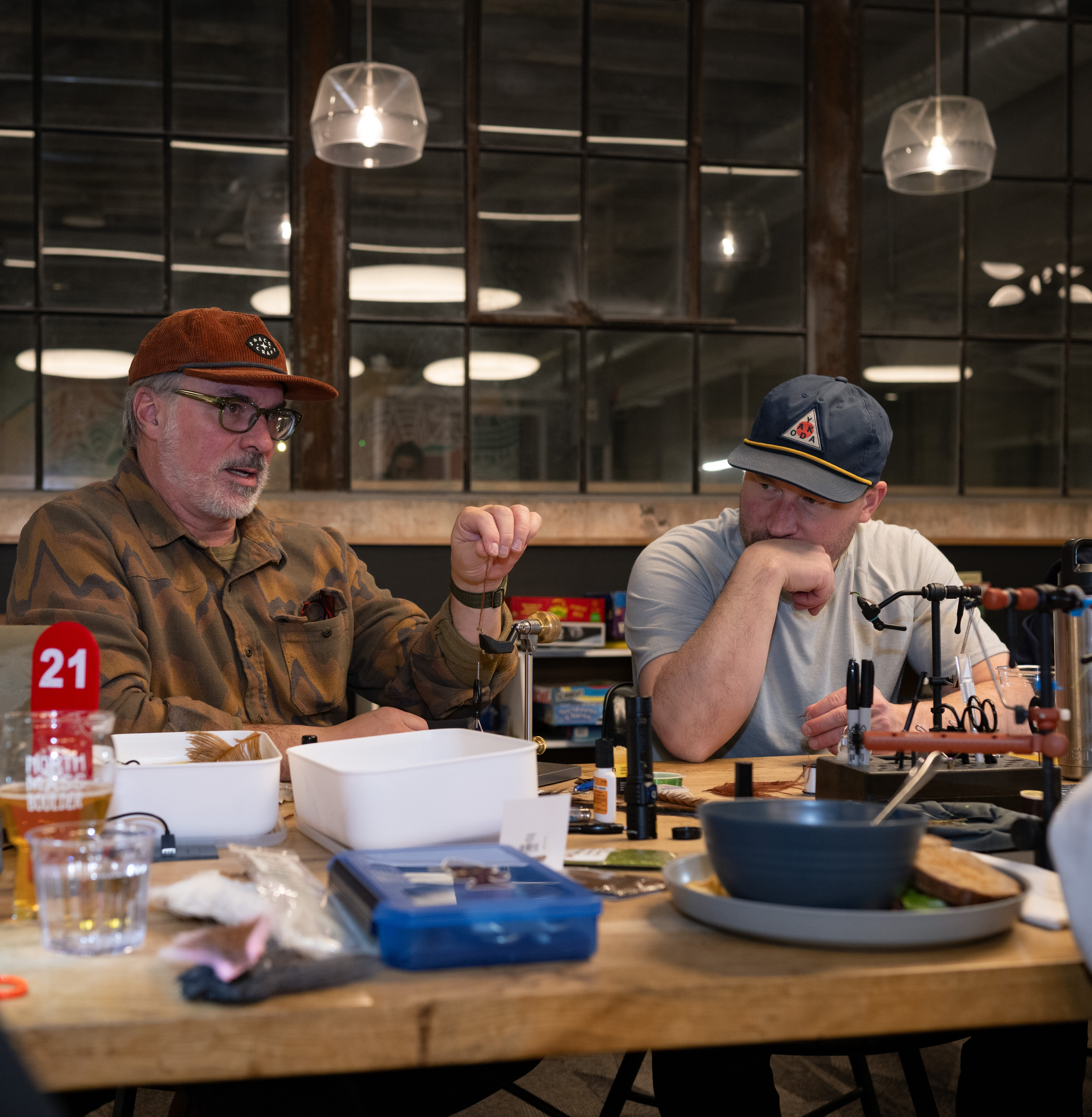 two white men fly tying at North Mass